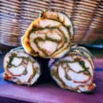 Sagohachi cured torihamu rolled with smoked kale powder and dried peppers.