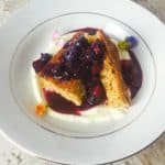 Brown Sugar Cake, Cake Batter Ricotta, Blueberry/Strawberry/Mezcal Sauce, Edible Flowers and chili Worm salt