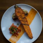 Carrot steak with carrot sauerkraut puree on pumpernickel and a kimchee kraut.